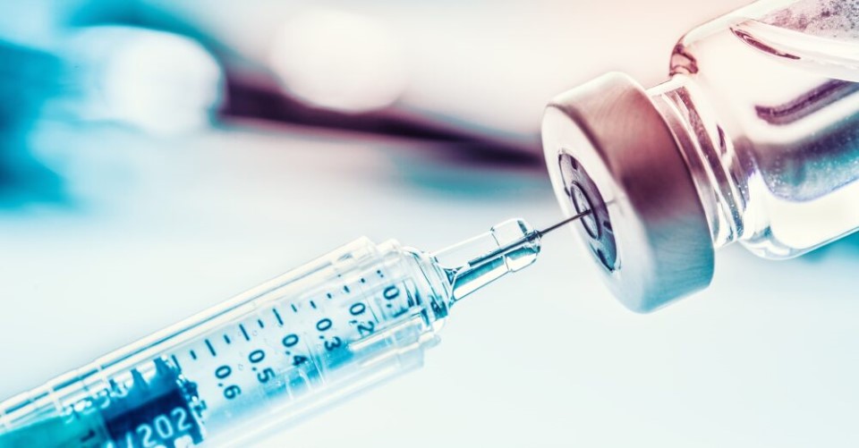 Close Up Medical Syringe With A Vaccine.