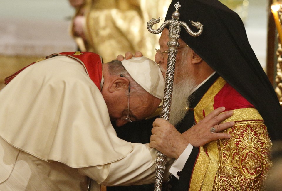 Pope Francis, Ecumenical Patriarch Bartholomew of Constantinople embrace during prayer service in Istanbul