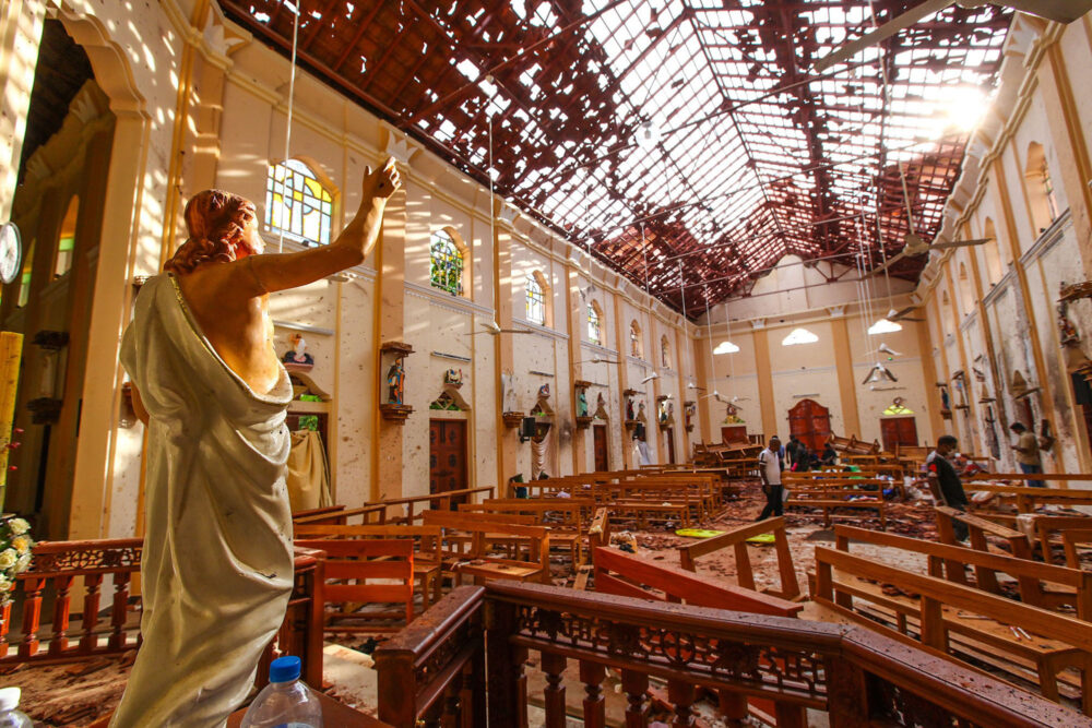 Multiple explosions in Sri Lanka kill at least