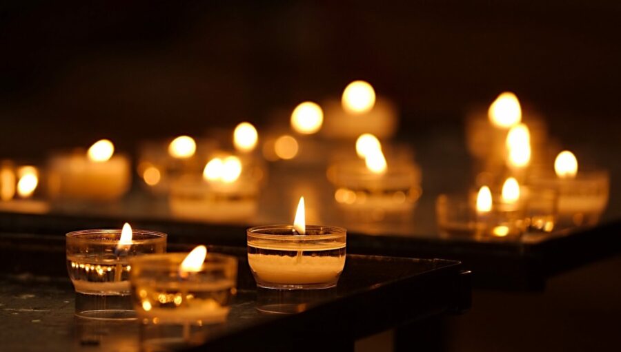 Rows,Of,Burning,Candles,In,A,Dim,Church