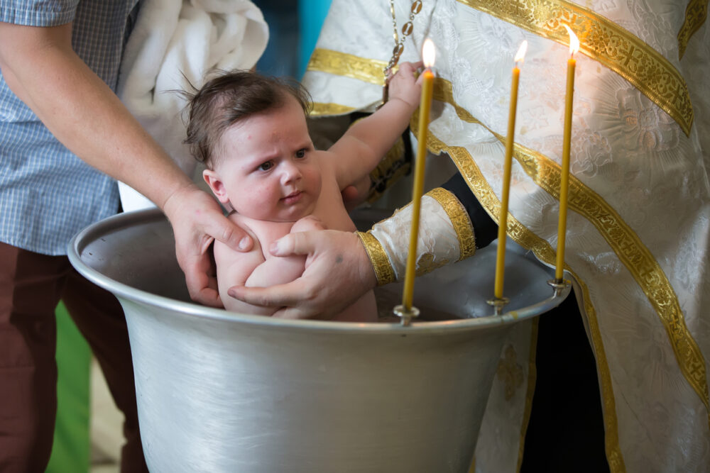 Baptism of a child. Ablution in holy water. Accepting faith. Orthodox baptism