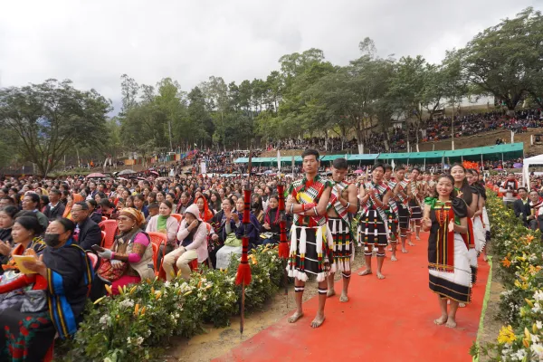 Tribal dancers waiting for their turn in the midst of the crowd