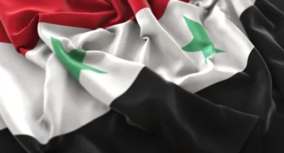 Syria flag ruffled beautifully waving macro close up shot