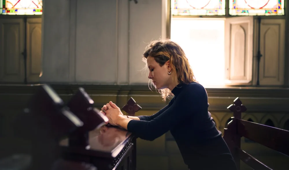 Woman praying church